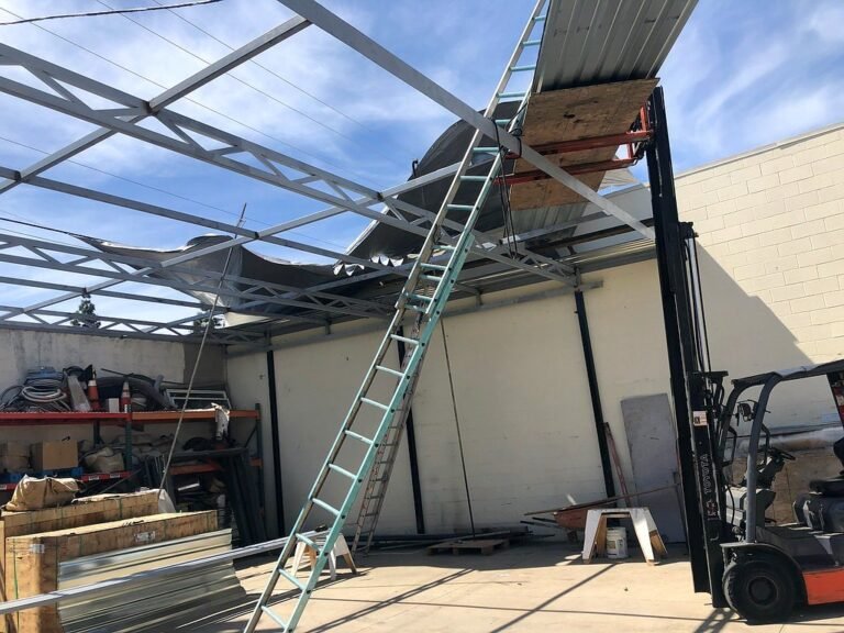 Steel frame structure being fabricated and installed